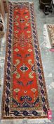 Turkish style red ground runner with floral and stylised bird pattern and multiple geometric borders