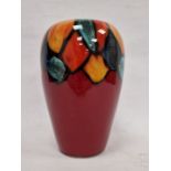 Modern Poole pottery vase, circular and tapering, the red ground with abstract petal border, in
