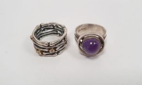 Two various silver rings, one set with cabochon amethyst and the other with three tiny diamonds (2)