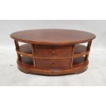 Modern Wills & Gambier oval coffee table with assorted shelves and drawer, on bracket feet