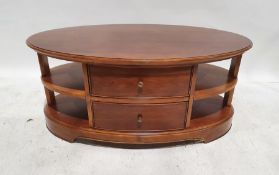 Modern Wills & Gambier oval coffee table with assorted shelves and drawer, on bracket feet