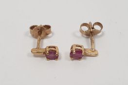 Pair of 9ct gold and ruby earrings, approx. 1.0g total