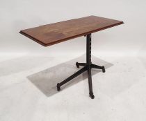 20th century iron and oak adjustable table, the rectangular oak top with moulded edge and rounded