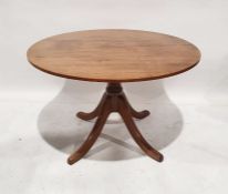 Modern circular oak breakfast table on single pedestal to four ogee supports, 113cm diameter x