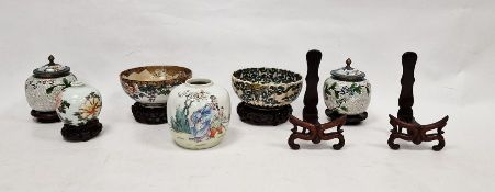 Japanese porcelain bowl with panel of archer and kneeling figure in landscape on a floral