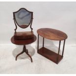 19th century mahogany shield-shaped dressing mirror with three drawers to the bowfront base, on ogee