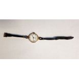 Lady's 9ct gold-cased wristwatch, the enamel dial with Roman numerals and subsidiary seconds hand,