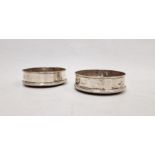 Pair of silver wine coasters, circular and plain with raised border, Sheffield 1970 and turned