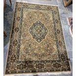 Large modern green ground rug with central floral medallion and multiple floral borders 200cm x