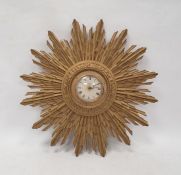 Mid 20th century sunburst wall clock with Roman numerals on a dial marked 'Smiths 8-day', 49cm