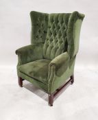 Late 19th/early 20th century green upholstered wingback chair on square section front legs to