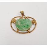 14k yellow gold filigree pendant set with jadeite