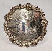 Victorian silver salver of circular form, with scalloped scrolling edge and scrolling engraved