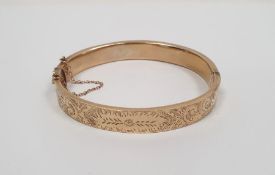 9ct gold bangle with engraved decoration, 12.5g approx. (several dents)