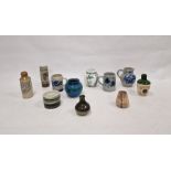 Three German stoneware items, a Cinqueport pottery cylindrical vase (damaged), a small Prinknash
