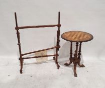 Late Victorian games table, the circular top with chess board inlay, on three turned and ring