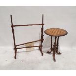 Late Victorian games table, the circular top with chess board inlay, on three turned and ring