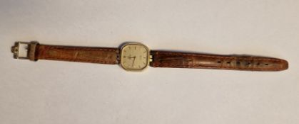 Lady's rolled gold-cased Omega wristwatch, the champagne square dial with hour batons, on a