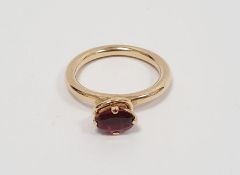 14k gold ring set with oval tourmaline-type stone and the miniature diamond ring collar, stamped