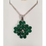 Silver and emerald pendant, quatrefoil-shaped, set multiple oval cut stones, on fine silver chain