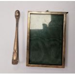 Silver bright cut pair of sugar tongs, marked GV and a silver photograph frame (2)