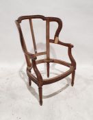 Early 20th century carved chair frame in the French fauteuil manner, on turned and fluted front legs