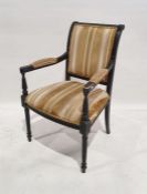 Early 20th century armchair in gold striped upholstered back, seat and arms, on wrythen turned and