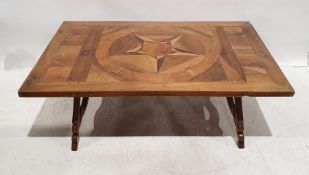 Parquetry rectangular coffee table on shaped end supports, with iron stretchers, 47cm x 150cm x