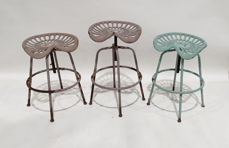 Three stools with reproduction vintage tractor seats, on metal bases (3)