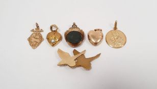 9ct gold brooch, birds flying, a 9ct gold pendant, a 9ct gold St Christopher, a gold locket pendant,