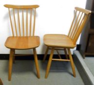 Set of four stickback pine-seated dining chairs in the Ercol taste, marked 'Czechoslovakia' to