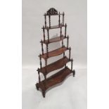 Victorian rosewood six-tier waterfall whatnot, each serpentine fronted tier supported by