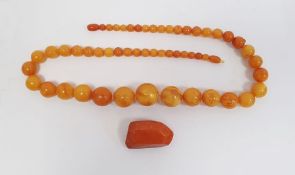 Butterscotch amber circular beaded necklace, 70g approx. and an amber brooch (2)