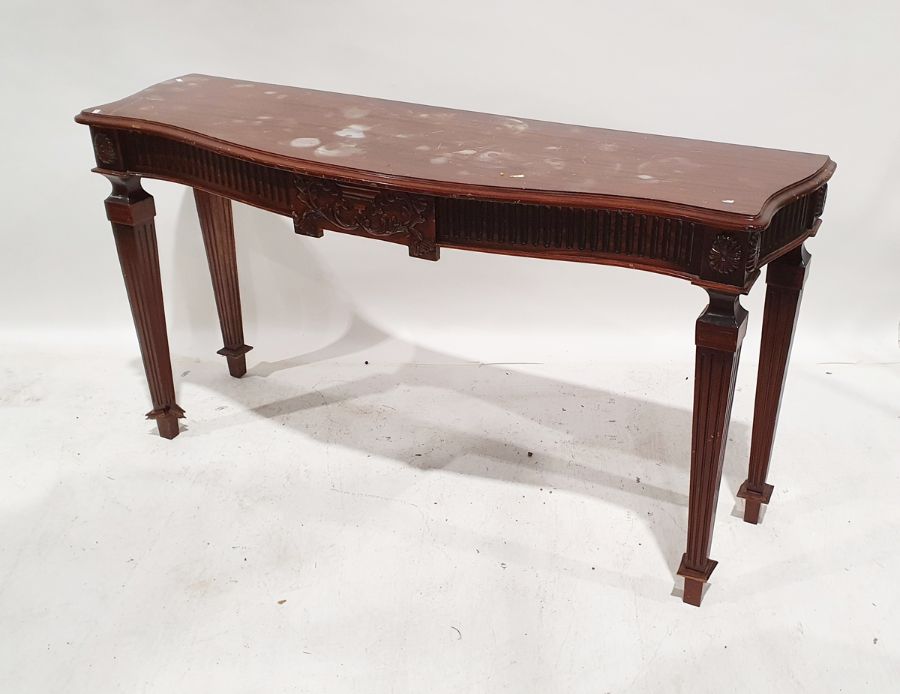 20th century mahogany serpentine-fronted hall table on square section fluted supports  Condition