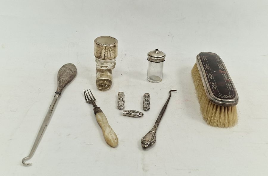 Tortoiseshell and silver-backed brush, a silver-handled button hook, etc (1 tray)