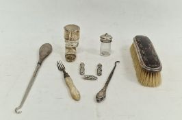 Tortoiseshell and silver-backed brush, a silver-handled button hook, etc (1 tray)