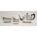 Three-piece Irish silver tea service to include teapot, sugar pot and cream jug, of oblong form with
