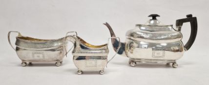 Three-piece Irish silver tea service to include teapot, sugar pot and cream jug, of oblong form with