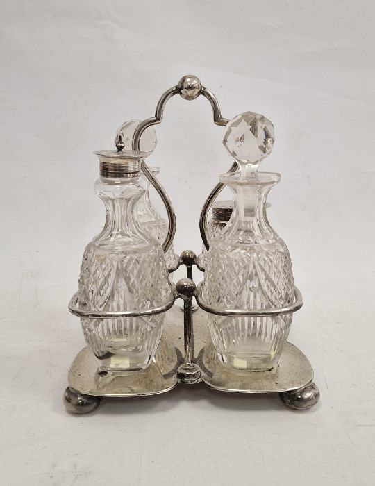 Edwardian silver four-section cruet stand with glass bottles, possibly Mark Willis Sheffield 1901,