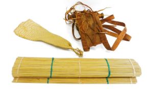 Late 19th/early 20th century, Ugandan leather and wood baby carrier, along with a woven reed beer