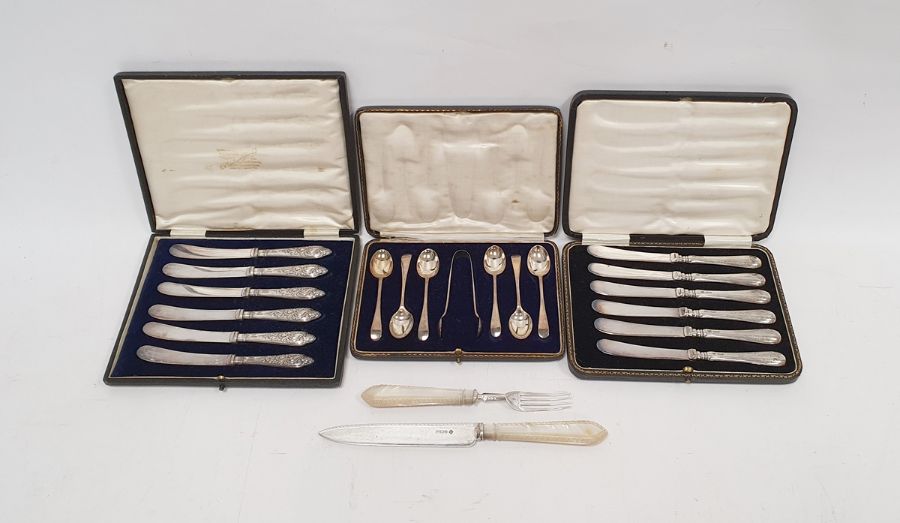 Cased set of six silver-handled knives, a cased set of six silver teaspoons with sugar tongs, a