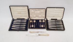 Cased set of six silver-handled knives, a cased set of six silver teaspoons with sugar tongs, a