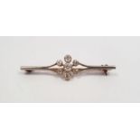 Platinum and seven-stone diamond cluster bar brooch, centre diamond approx. 0.25ct  flanked by two