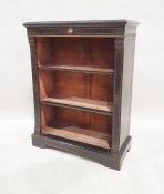 Victorian open bookcase, the rectangular top with moulded edge above a ceramic plaque of a head in