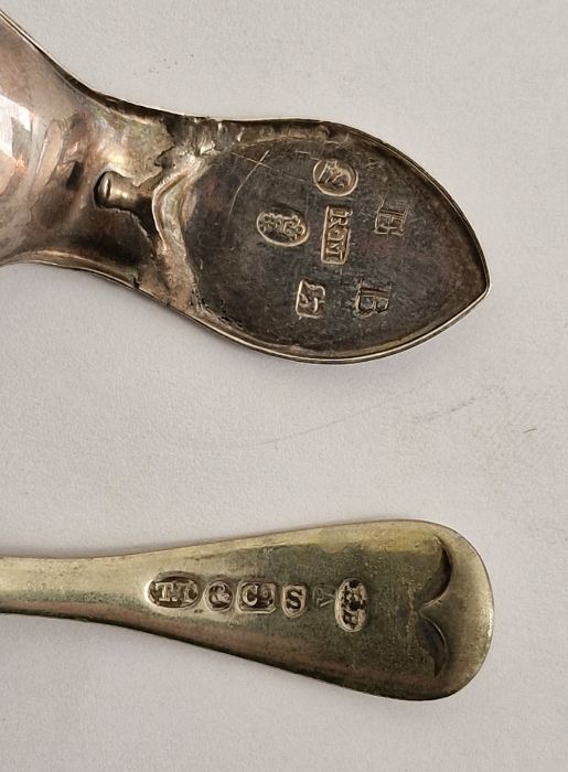 Three Georgian silver tea caddy spoons each with shell bowls, a Victorian egg-shaped tea infuser - Image 7 of 7