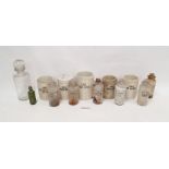 Assorted late 19th, early 20th century glass and ceramic apothecary jars.