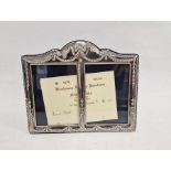 Modern silver double photograph frame with bow and swag decoration, 18cm x 22cm