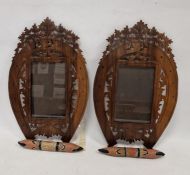 Pair of early 20th century wooden picture frames in the form of horseshoes with carved fretwork