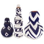 Two African beaded gourds and beaded bottle, featuring blue and white zig-zag and diamond patterns.