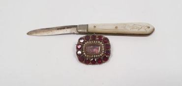 19th century gold-coloured metal, seedpearl and almandine garnet brooch set central stone surrounded